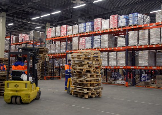 A huge warehouse.Creative.A large storage of orders, which are carried by special boxes and moved by
