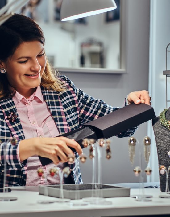 Woman seller in a luxury jewelry store.